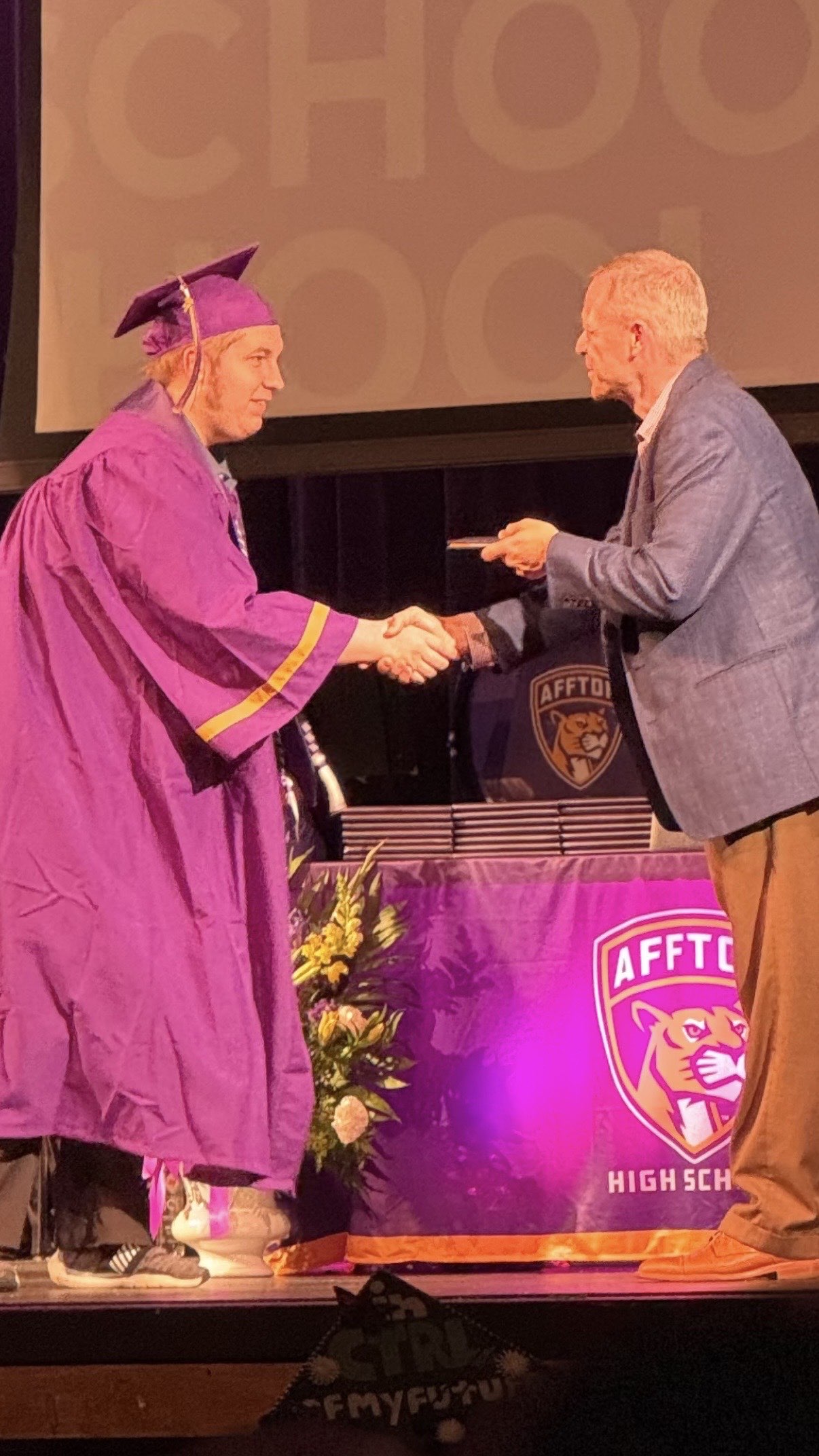 Shaking hands and receiving my diploma
